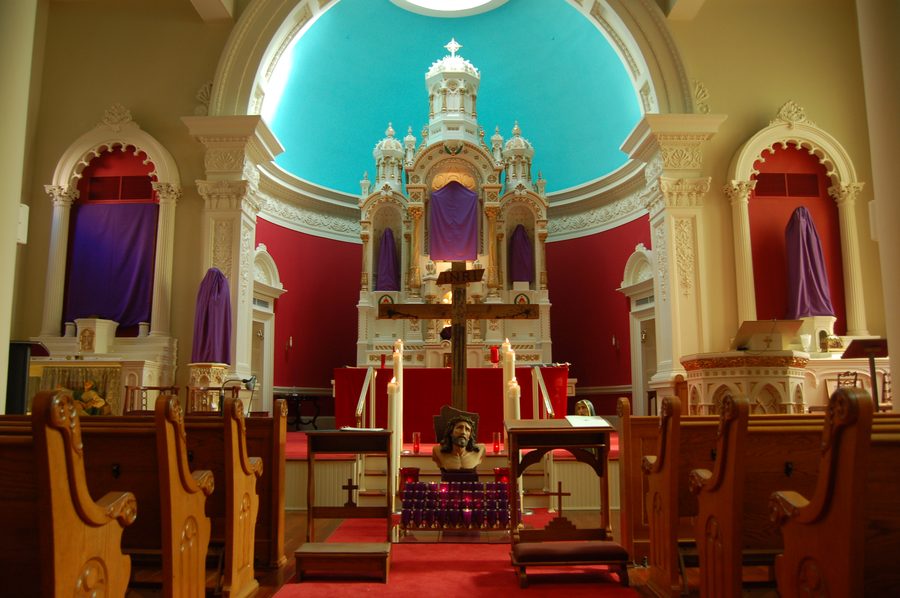 The high altar with crucifix and candles